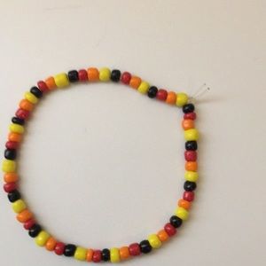 Black, red, orange, and yellow beaded bracelet.